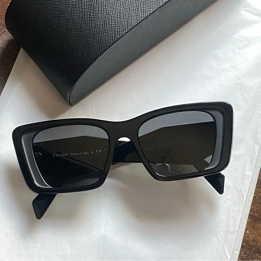 Prada Eyewear black square frame sunglasses logo sides Revolve in case $489